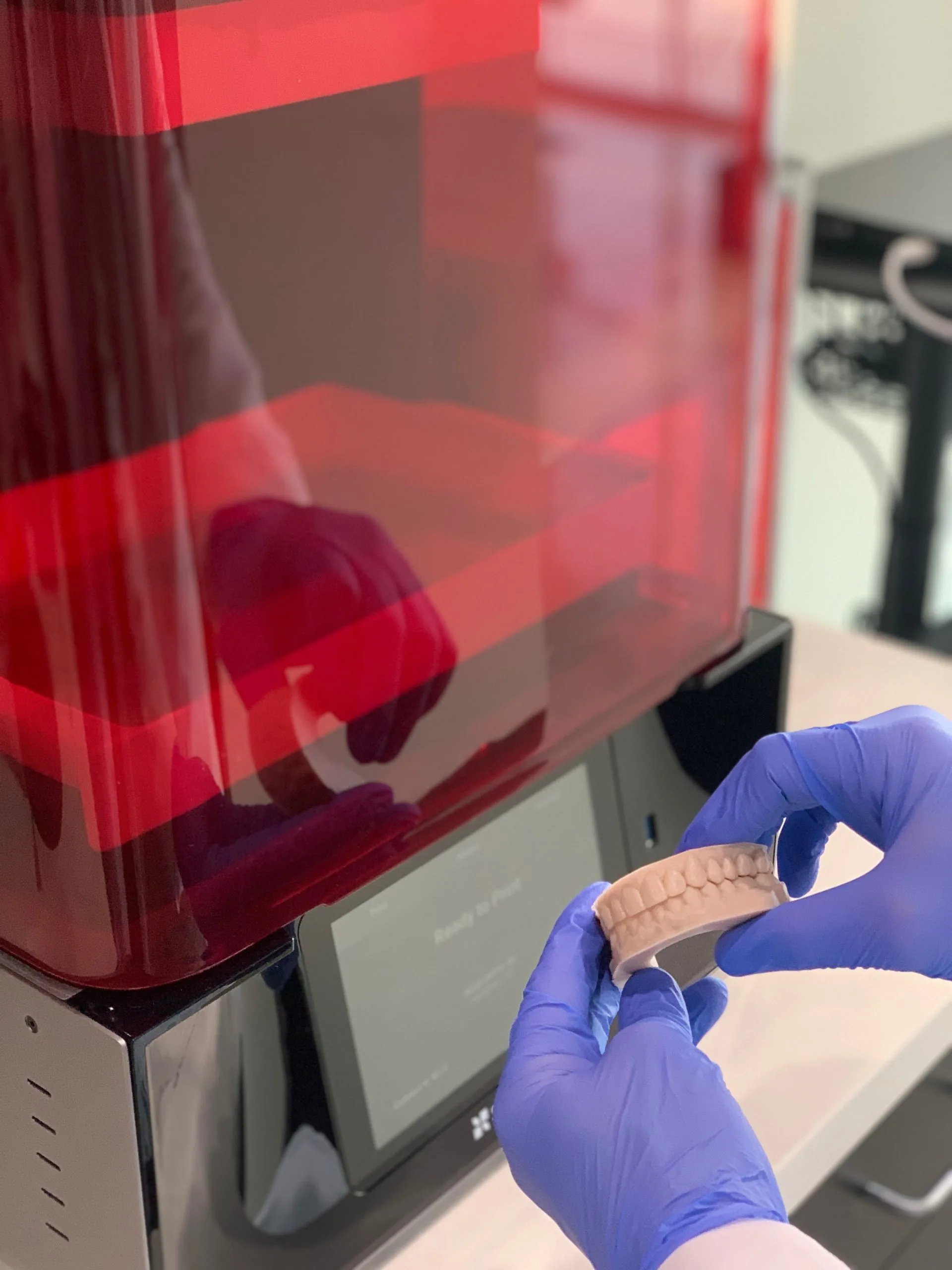 Printed Teeth Models in front of 3D Orthodontic Printer