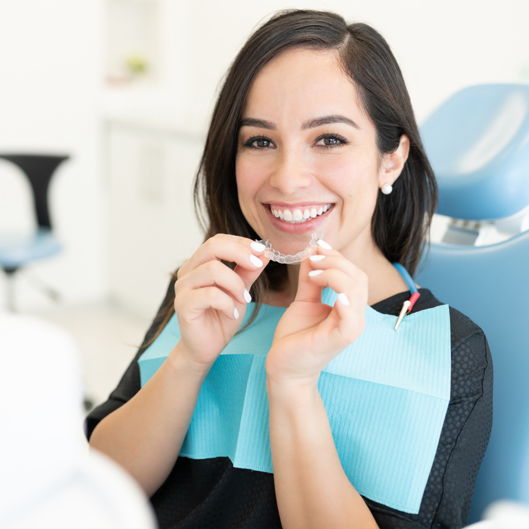 Patient with Aligners in hand